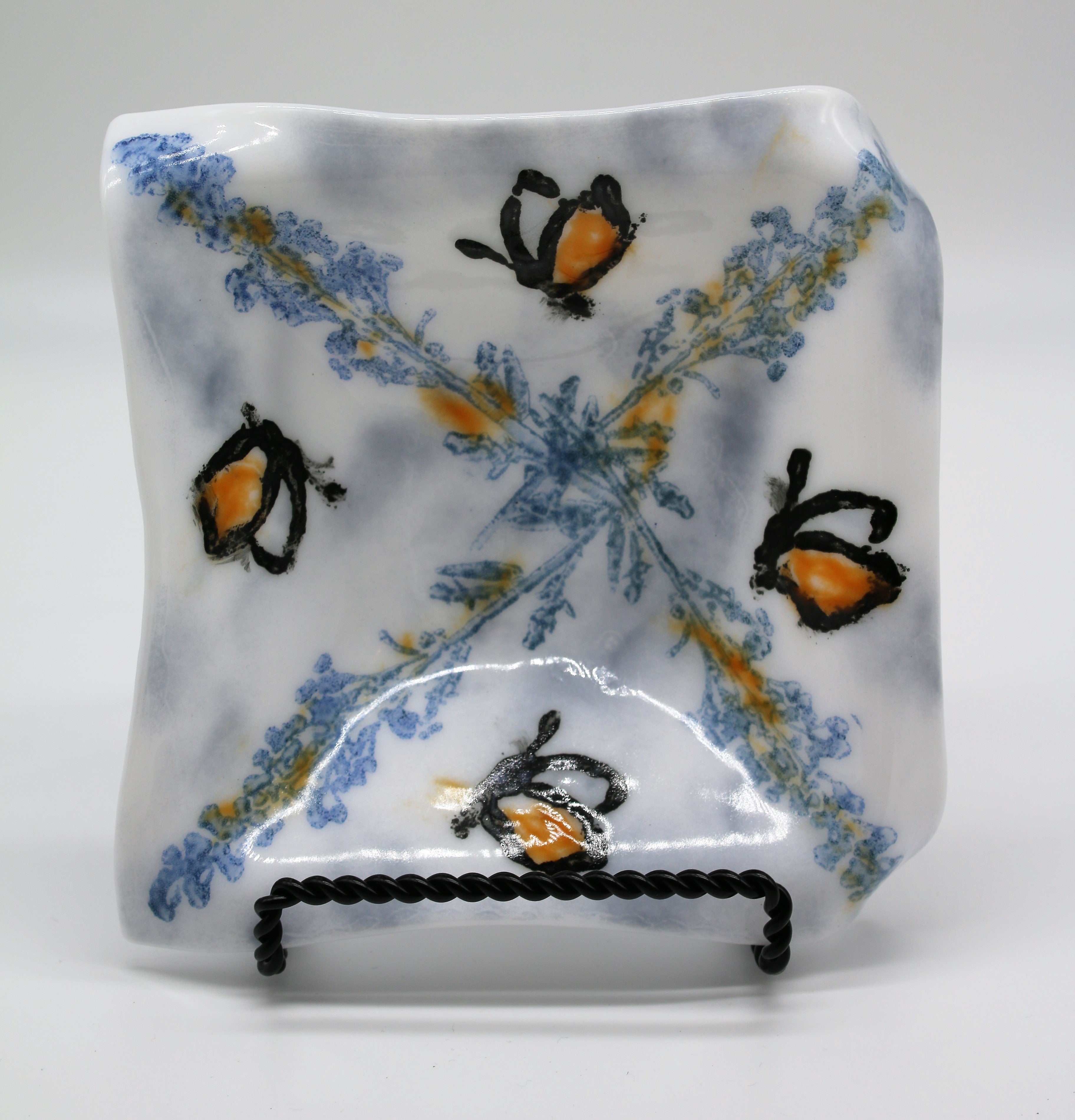 White Dish with Blue stamping and black butterflys
