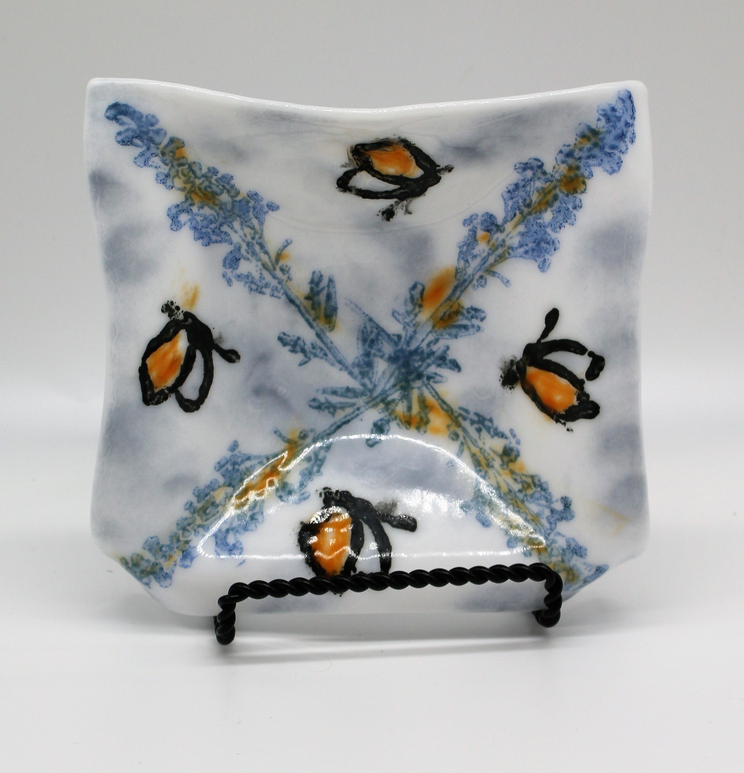 White Dish with Blue stamping and black butterflys