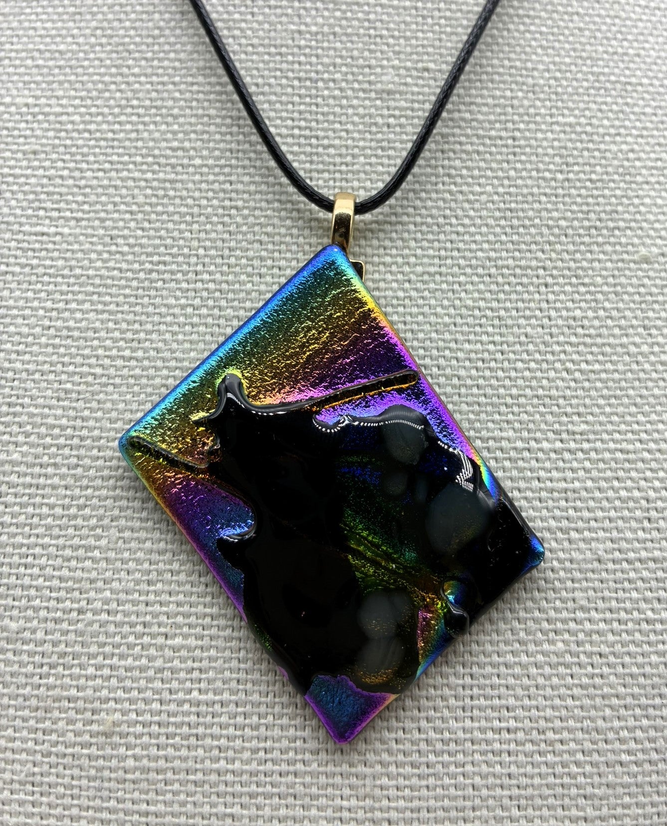 Jewelry -Offset square of black glass with dichroic and Black shiny glass - shape of witch on broom emerging.