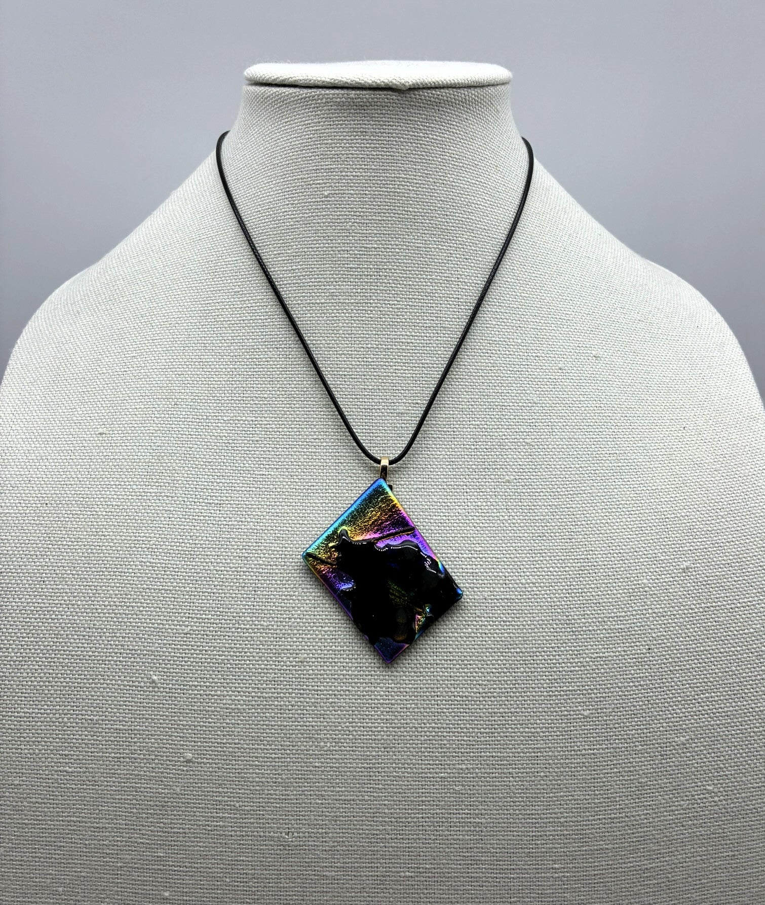 Jewelry -Offset square of black glass with dichroic and Black shiny glass - shape of witch on broom emerging.