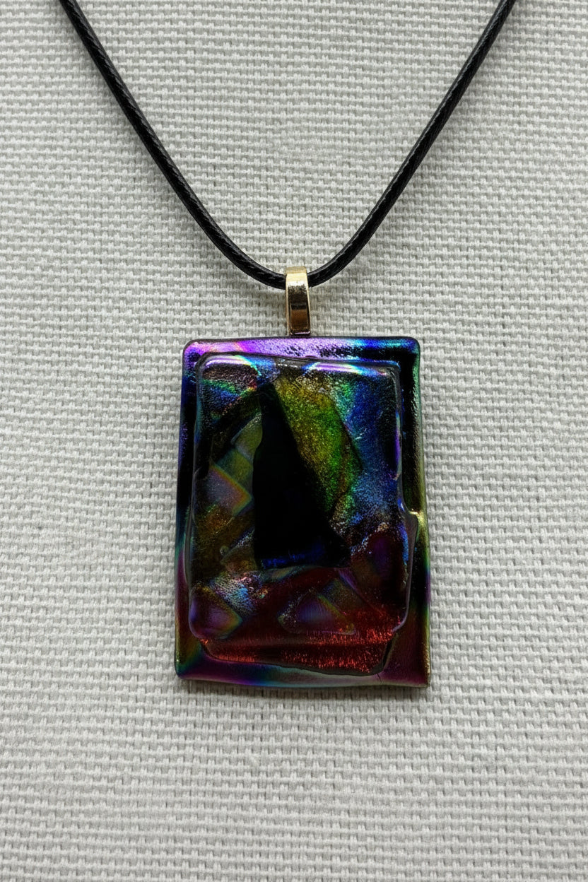 Jewelry - Small Rectangle Black with Varying Color pieces of Dichroic glass and small blue sail in middle