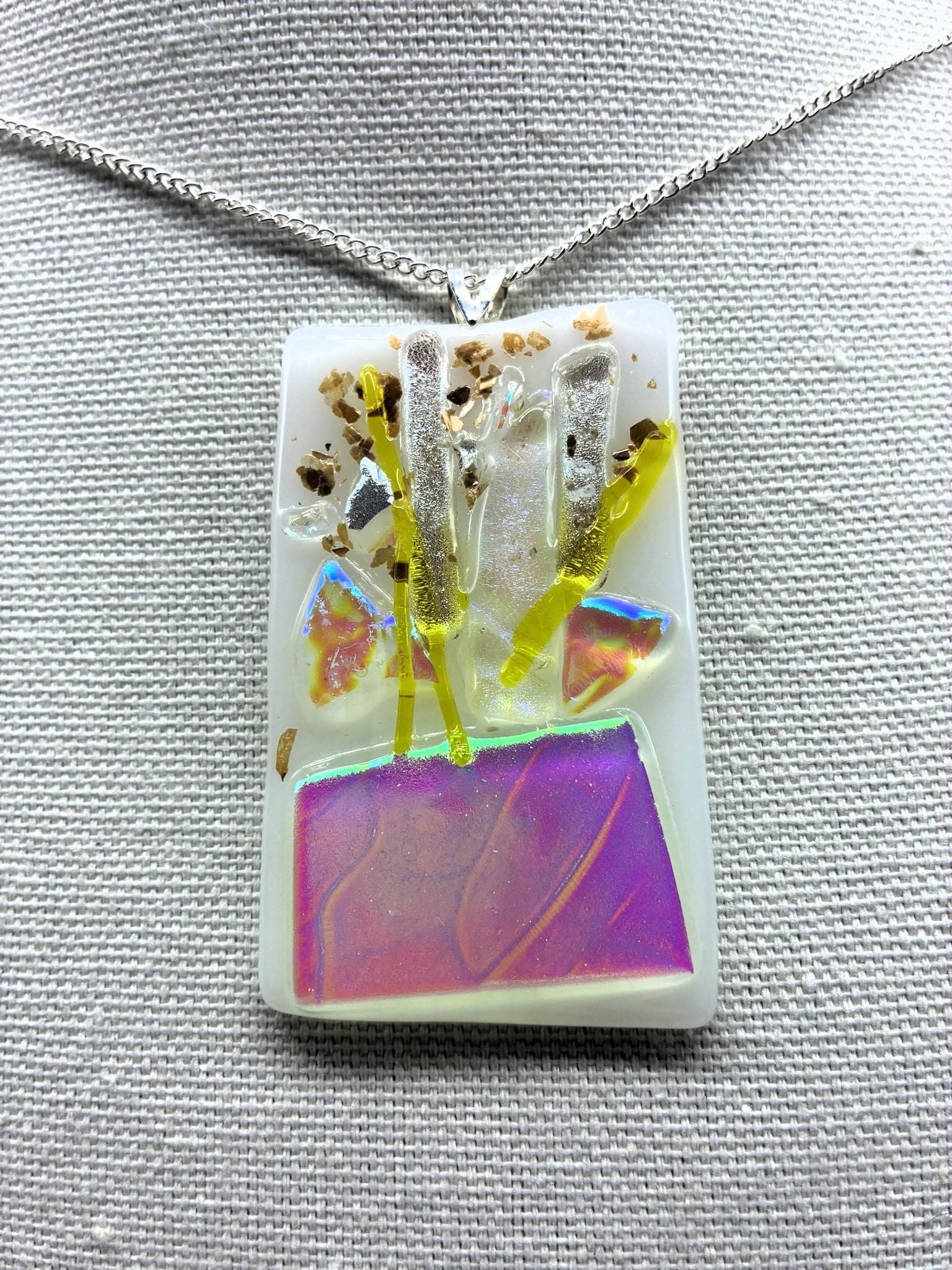 Jewelry- White Oblong glass with Silver, yellow and gold pieces of glass