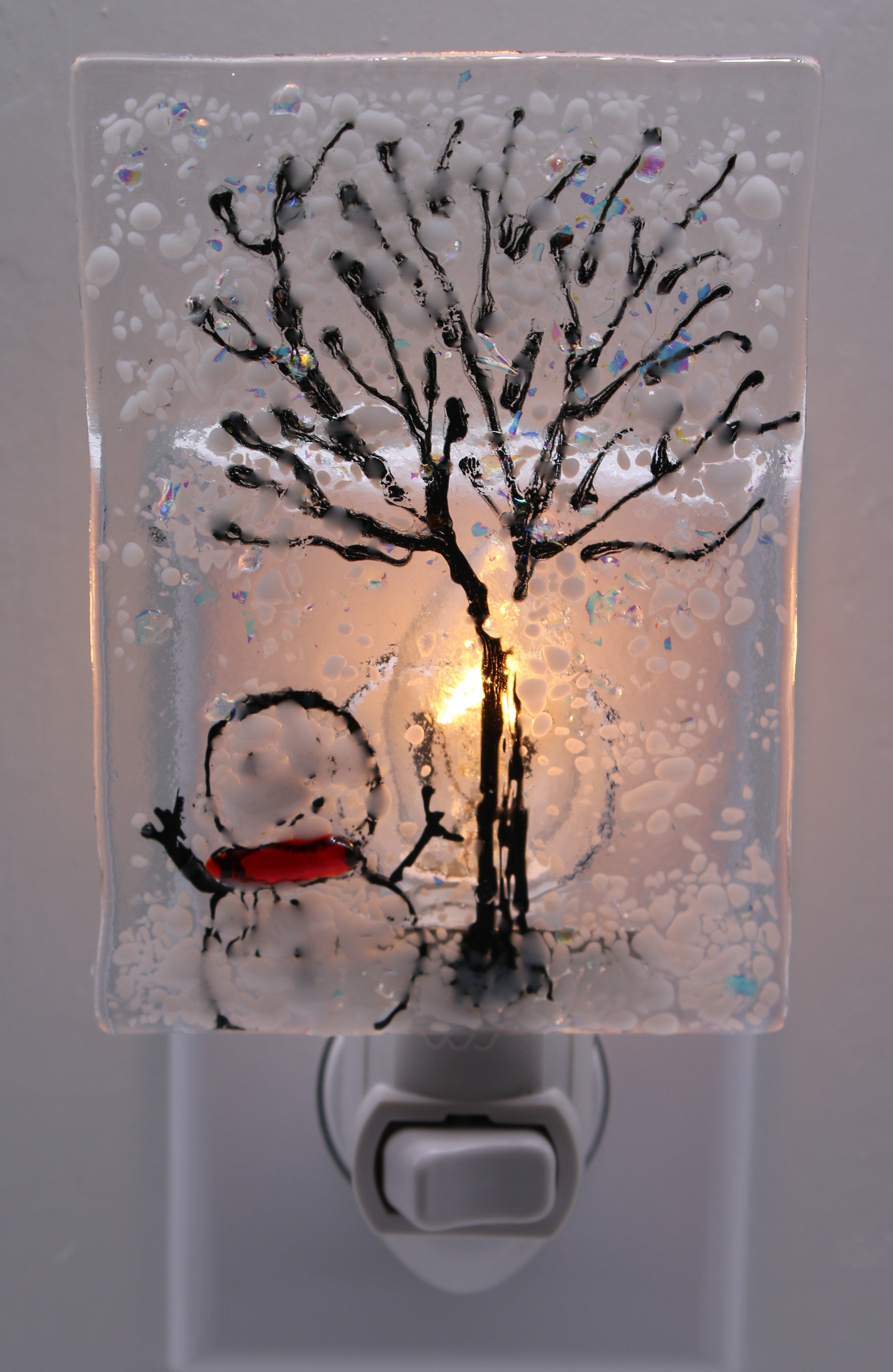 Snowman under Snowy Tree Light