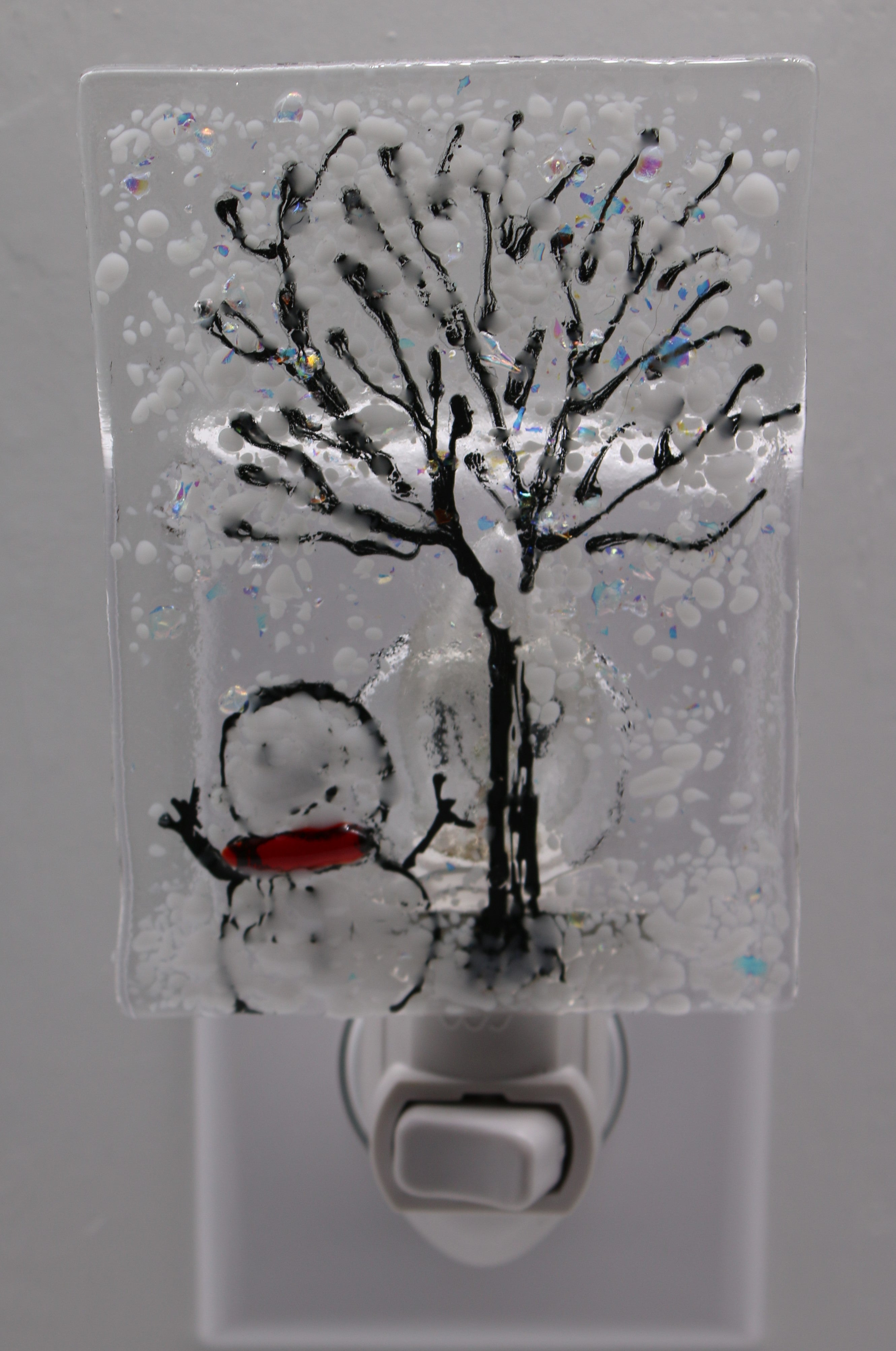 Snowman under Snowy Tree Light