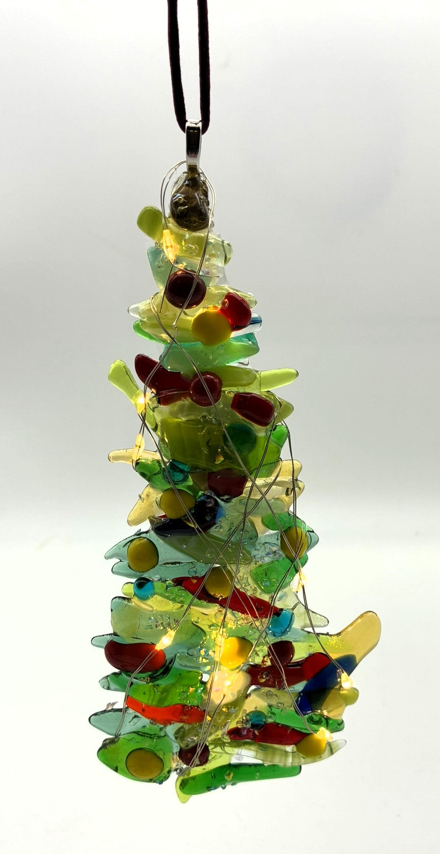 Mixed green and gold Christmas tree with red and yellow balls and lights ornament